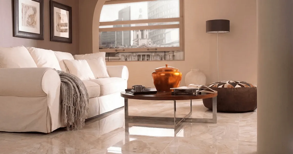 Modern living room with professionally installed marble flooring, a beige sofa, coffee table in San Antonio, TX